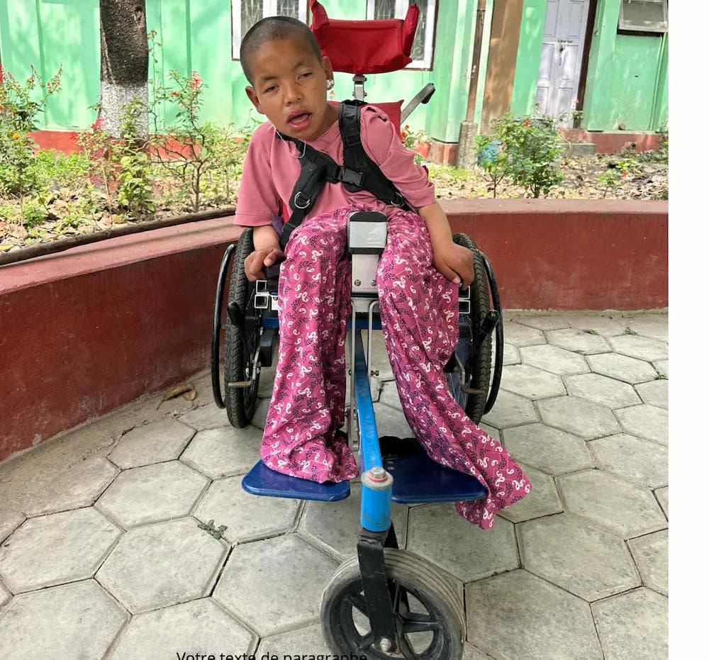 Occupational therapy volunteer adjusting a resident's wheelchair seating at a care home in Nepal